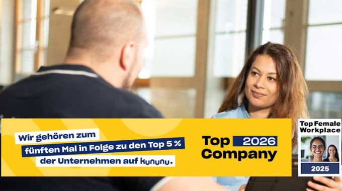 Mitarbeiter im Gespräch im Büro; eingeblendetes Kununu-Siegel „Top Company 2026“ und „Top Female Workplace 2025“.